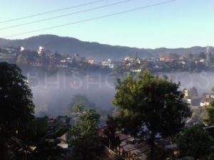The houses decorated by a variety of flora with an intense background of the mountain ranges