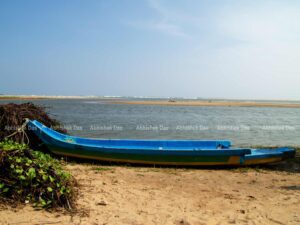 On the beachfront fishermen park their boats and assist tourists in a boating experience around this abandoned Fort