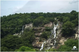 The mighty river Kaveri drops off through rocks and ravines to form twin falls
