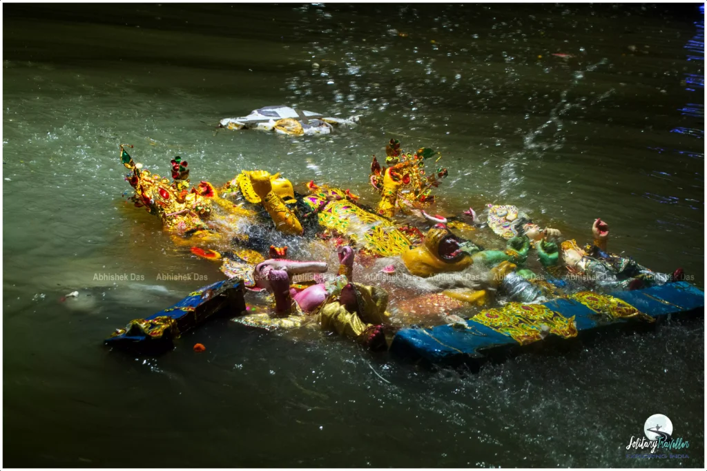 The same river, the Ganga, whose clay gave the idol its soul, is now ready to welcome her back